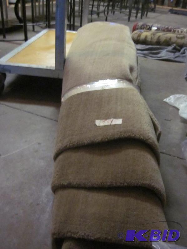 A two tone beige pattern area rug, 7.5 X 6....