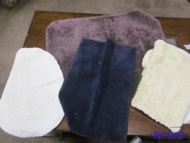 Lot of four bathroom rugs.  &nbsp  &nbsp...