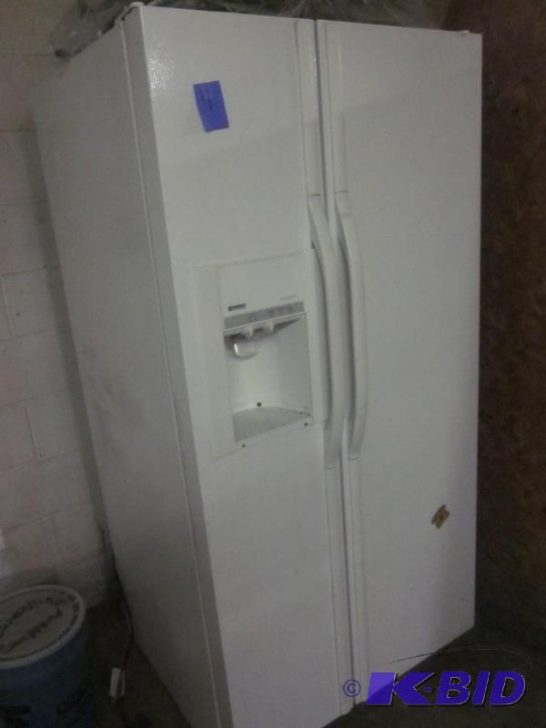 Side by side Kenmore refrigerator and freezer...