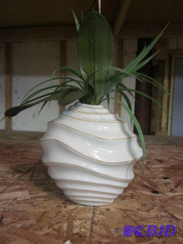 Ceramic vase with artificial plant.  &nbsp  ...