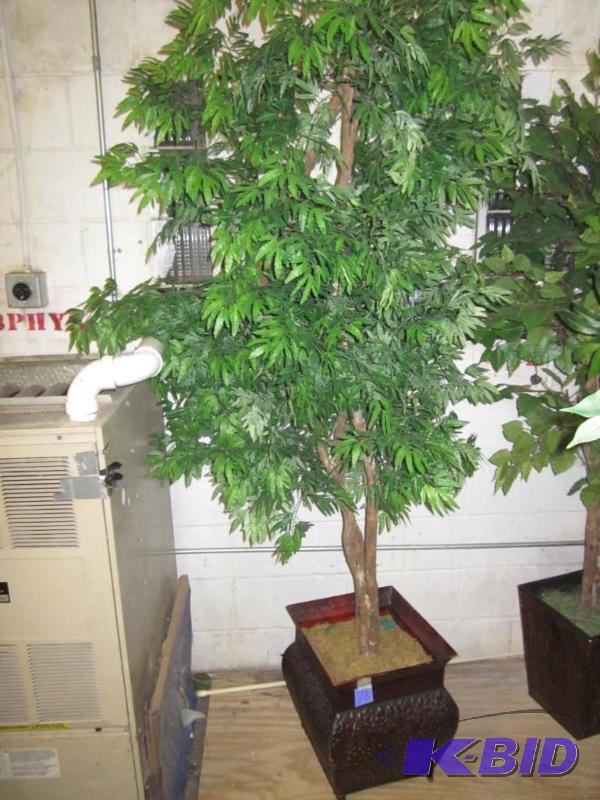 Artificial tree in planter.  &nbsp  &nbsp...