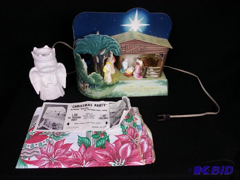 lot 25 image: Clemco Musical The First Christmas Wind-up Lighted Nativity  Christmas Party Table Cloth  Angel Candle