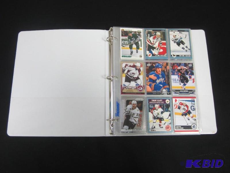 lot 38 image: Binder of Hockey, Football, Baseball & Basketball Cards
