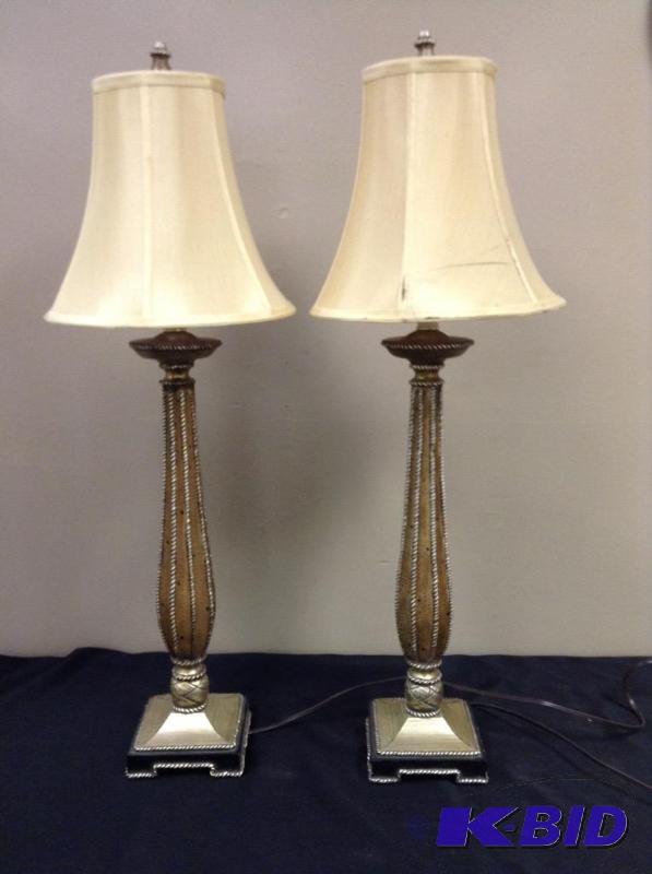 lot 63 image: Lot of two matching ornate gold table lamps from model home