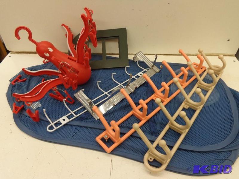 lot 130 image: Hooks, hangers, clips and a fold up bag...