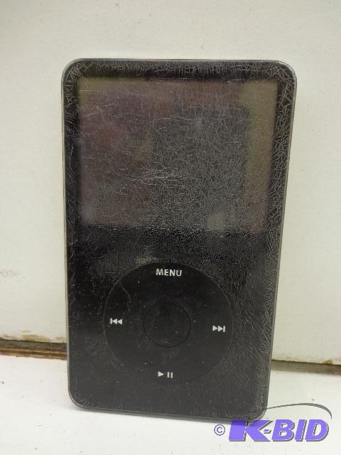 lot 58 image: Apple I Pod   Powers up  30 gig  Scratched up...