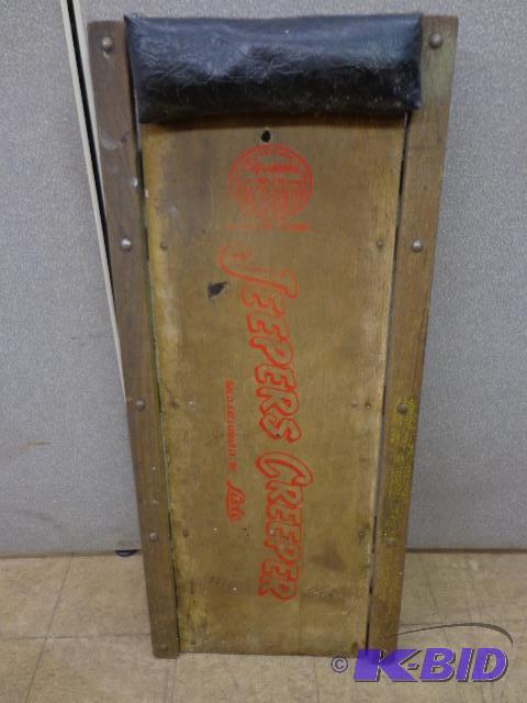 lot 73 image: Mechanics creeper   Wood platform w few hole...