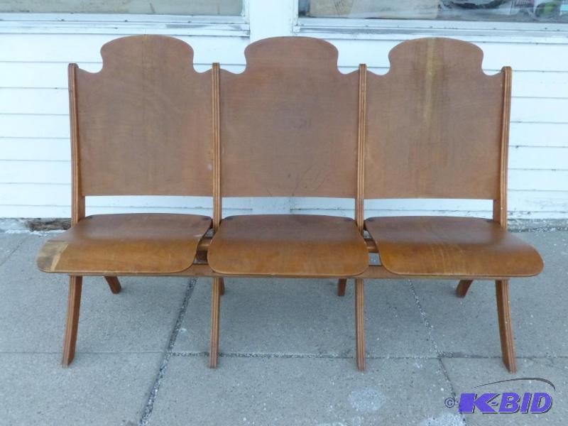 lot 1 image: A section of three vintage 1940s wooden thea...