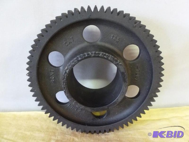 lot 129 image: Large steel gear that measures 7 34" ac...
