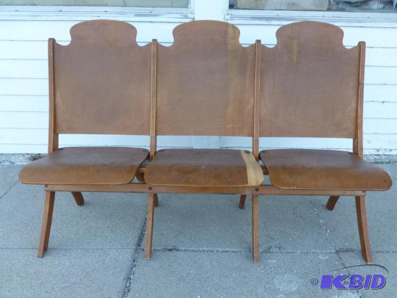 lot 2 image: A section of three vintage 1940s wooden thea...