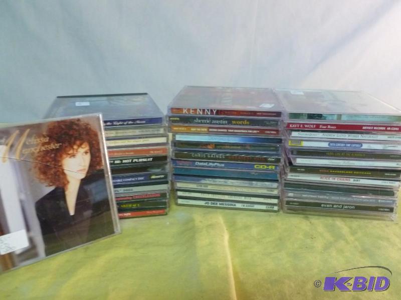 lot 213 image: Large lot of thirty-four music cds....
