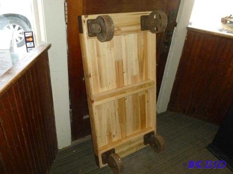 lot 35 image: Heavy duty four wheel wooden cart that measur...