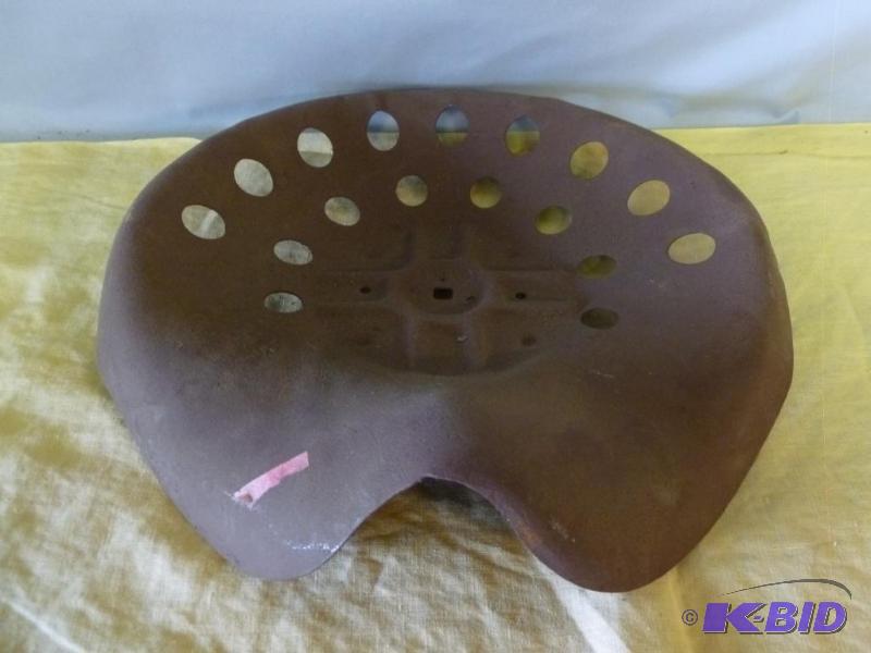 lot 57 image: Vintage metal implement seat that measures 15...