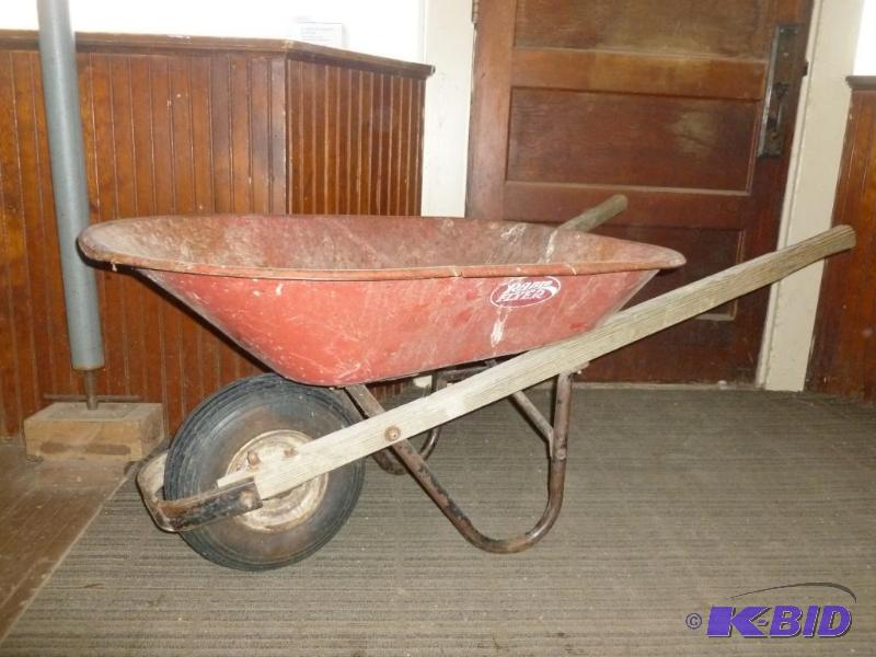lot 6 image: Heavy duty wheel barrow, tire looks good and ...