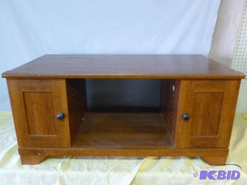 lot 7 image: Sauder&nbspwooden flat screen t.v stand that...