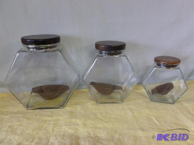 lot 80 image: Nice three piece glass kitchen canister set w...