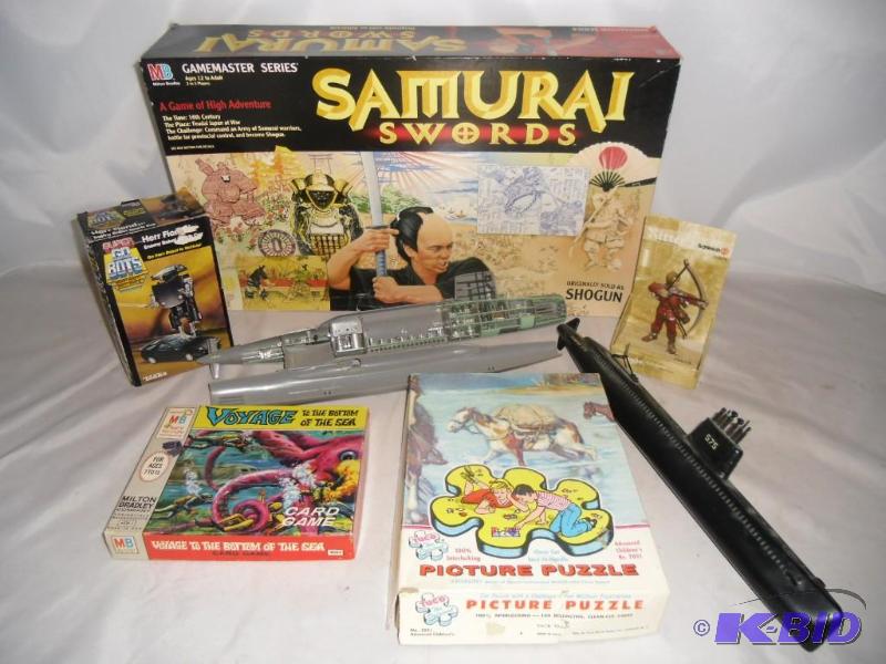 lot 16 image: Older and Newer Toys - Long Plastic Submarines,  Samauri Board Game, Voyage Bottom Sea Card Game