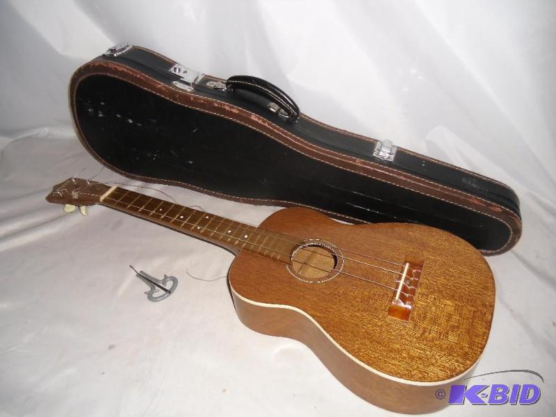 lot 3 image: A sour note  Musical Instruments in Need of TLC - Student Size Violin, Ukulele & Mouth Harp