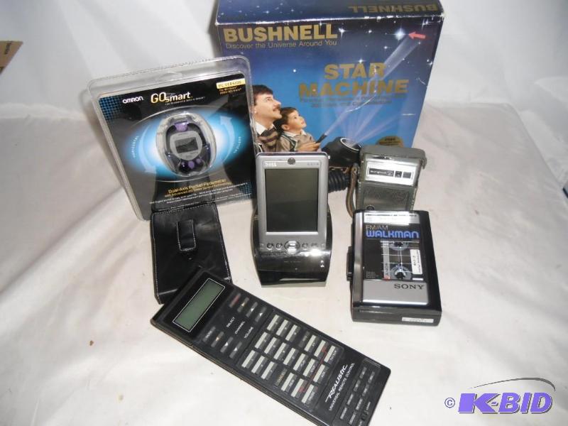 lot 34 image: Trash or Treasure Bushnell Star Machine Dell Pocket PC GO Pedometer Universal Remote  More