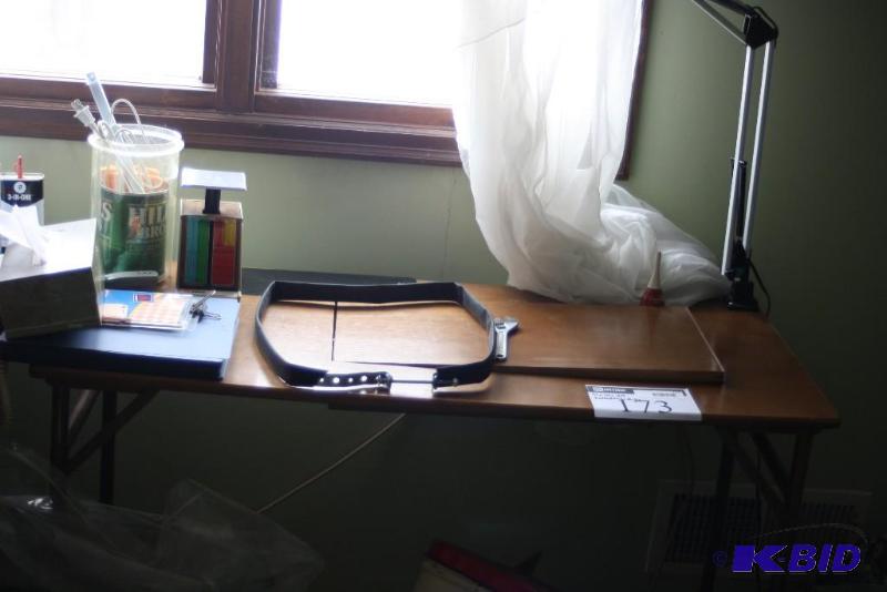 lot 173 image: Table Lot Including Table wSewing Machine Cut-Out Desk Lamp Scale And More.