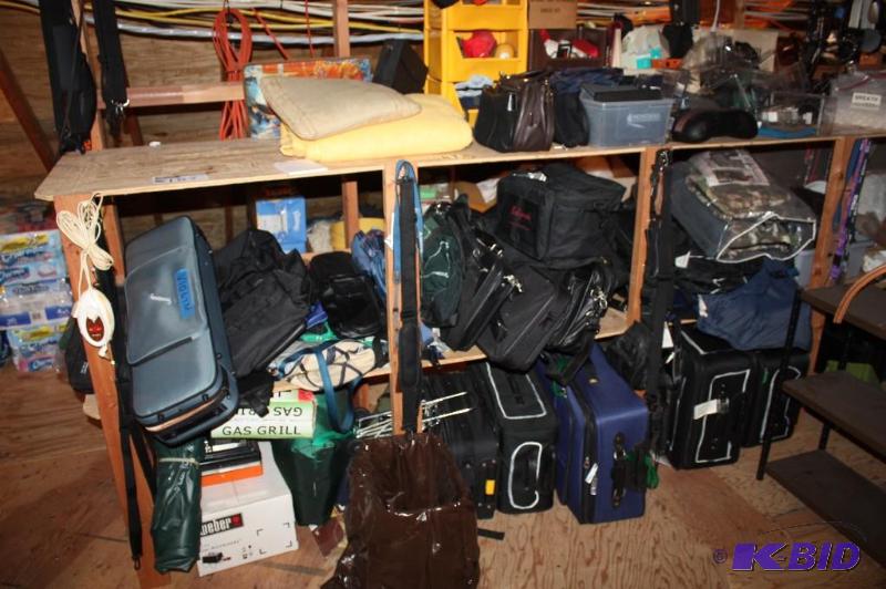 lot 187 image: Shelf Lot Including Suit Cases Cushioned Seat Stand Gas Grill And More.