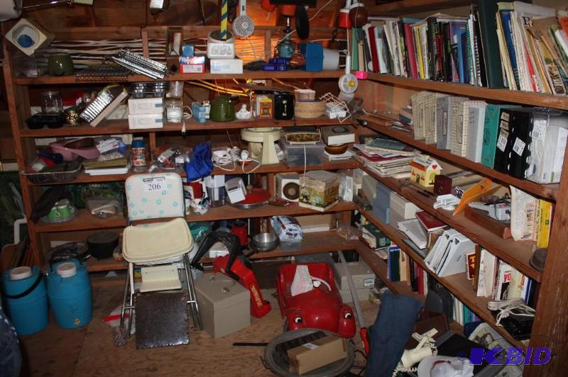 lot 206 image: Contents of Shelves & Floor Near Shelves Including Toy Car Chair Seeat Books And More.