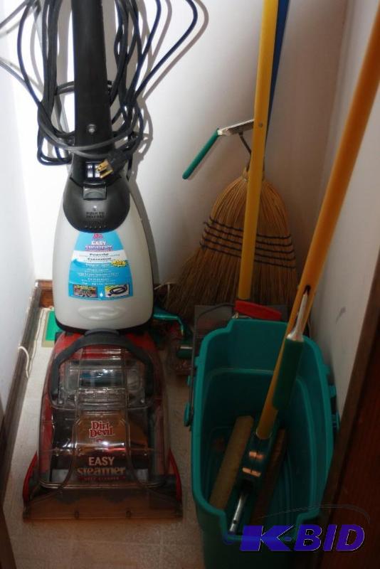 lot 243 image: Closet Lot Including Sponge Mop wSqueegee Broom Dirt Devil Easy Steamer And More.