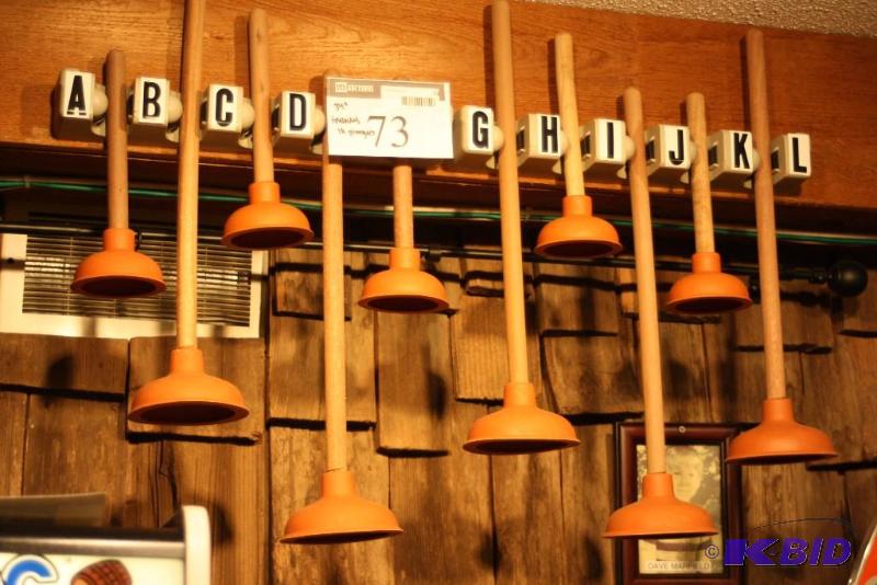 lot 73 image: Custom Toilet Plunger Game Includes 10 Plungers & Rack Requires Tools For Removal.