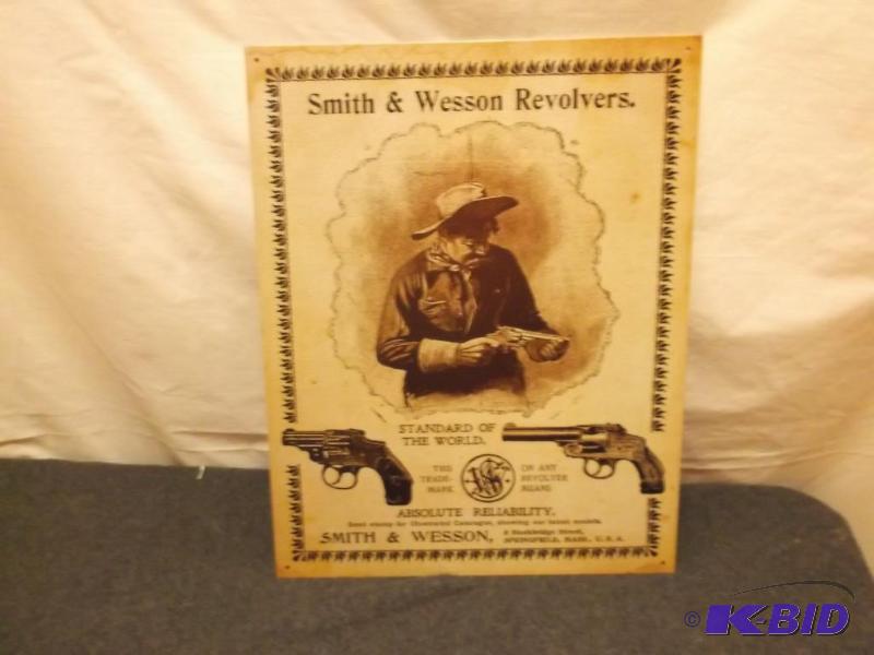 lot 15 image: Collectable metal Smith & Wesson sign mea...