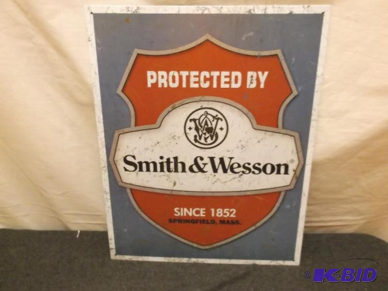 lot 20 image: Collectable metal Smith & Wesson sign mea...