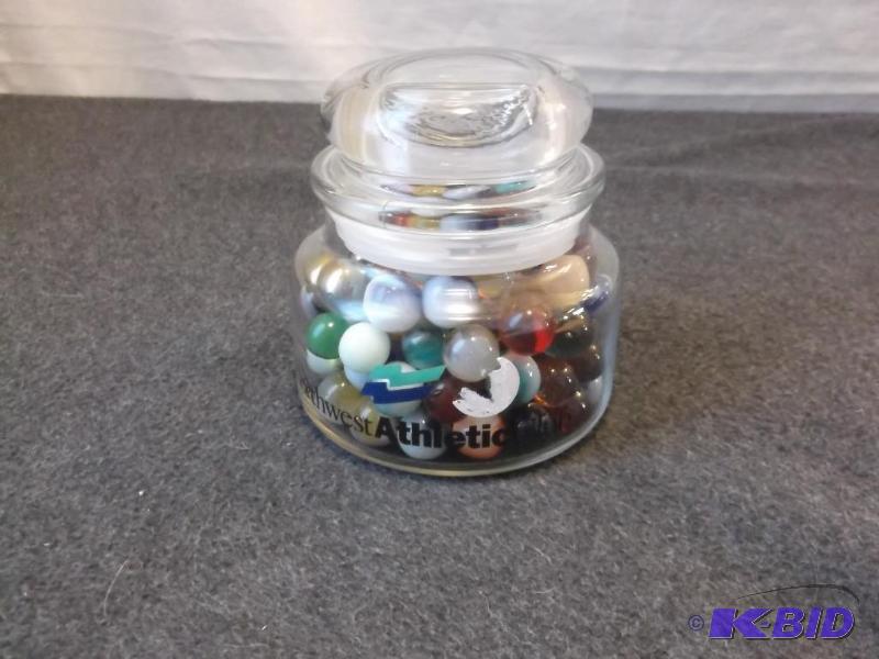 lot 29 image: Jar loaded with marbles....