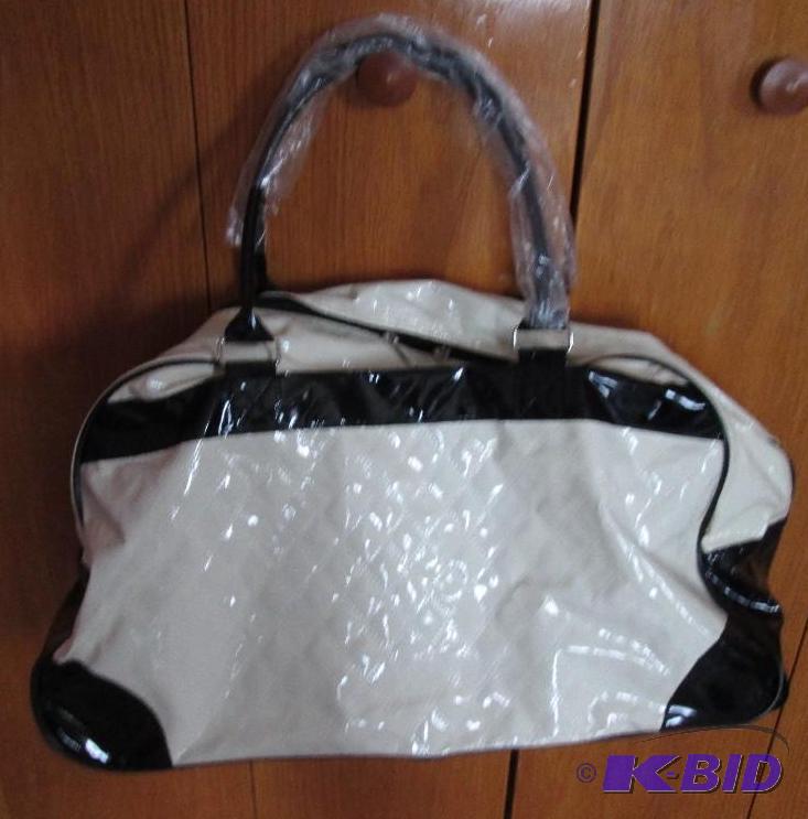 lot 77 image: Cream color with black outline purse, with wh...
