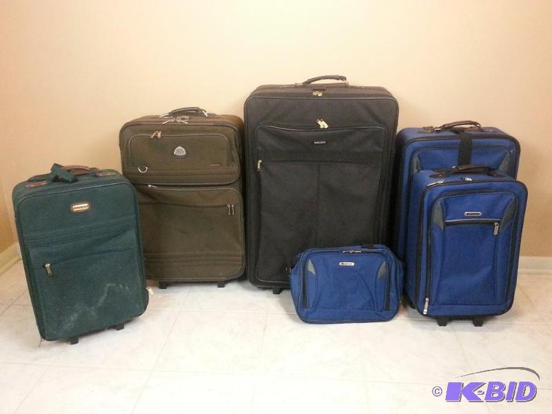 lot 34 image: Lot of (6) Pieces of Luggage - All Suitcases Are Rolling w Handles