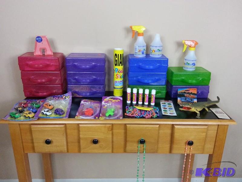 lot 86 image: Creative Kids Lot (11) Kids Totes, Toys, Penny Bears, Glue Sticks, Stickers, Pencils  Tote