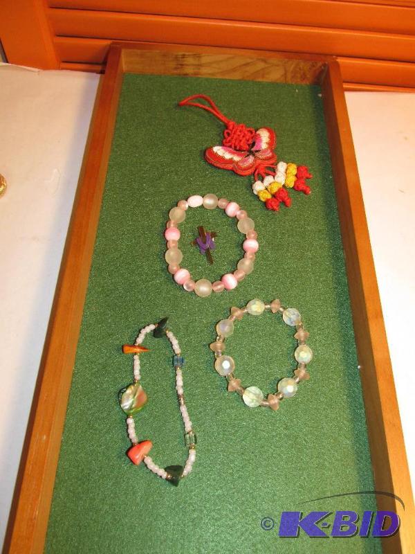 lot 131 image: Cross Pin, Three Bracelets and a Cute Hanging Thing