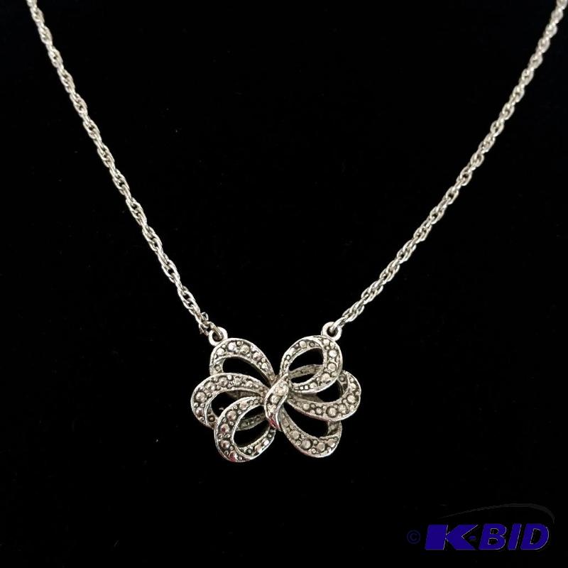 lot 8 image: Bow Pendant