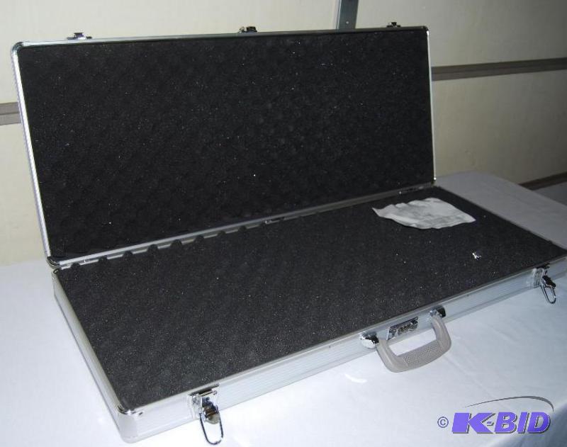 lot 74 image: AR- 15 Aluminum Assault Rifle Case, draw tigh...