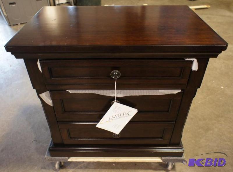 lot 13 image: New Ashley Signature Night Stand - MSRP $299....