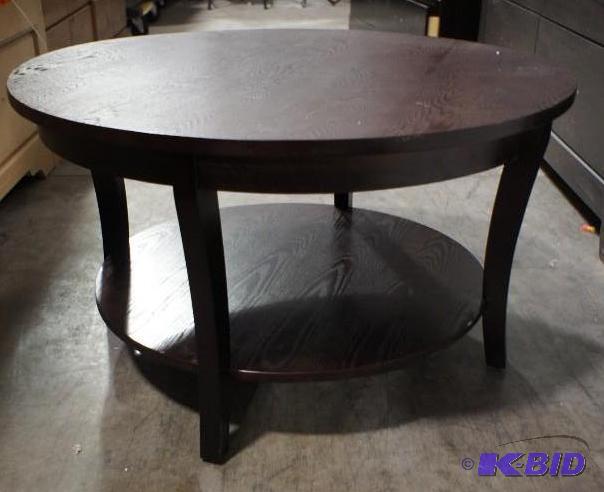 lot 18 image: New Ashley Signature Coffee Table - MSRP $99....