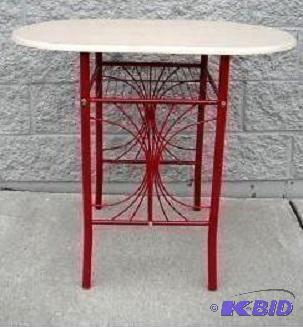 lot 13 image: Red Bistro Table - A sleek design with gracef...