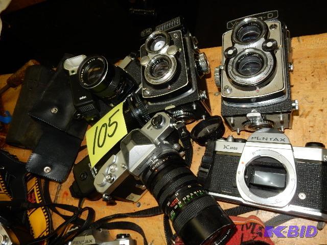 lot 105 image: 5,  35 MM Cameras and lens containers