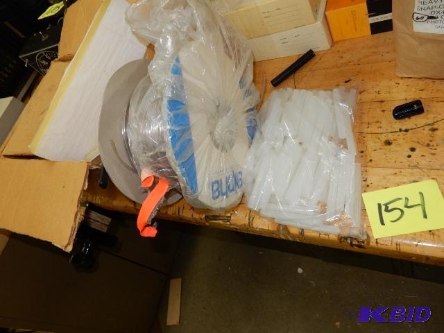 lot 154 image: 5 blocks of wax, roll of tube, glue sticks