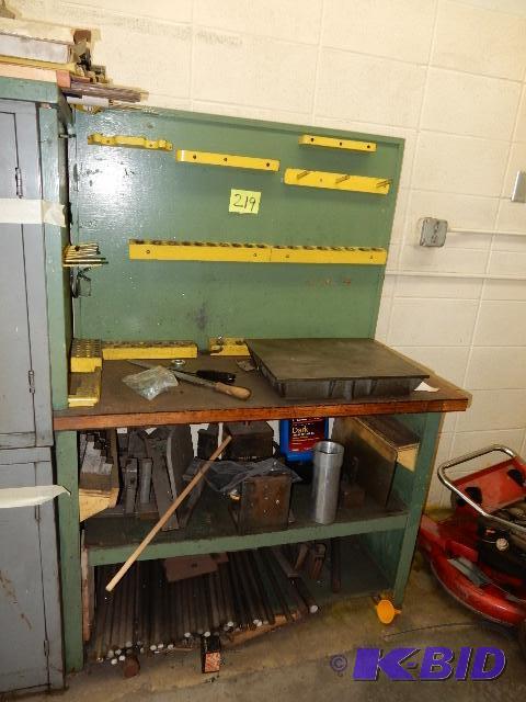 lot 219 image: Wood workbench with contents.