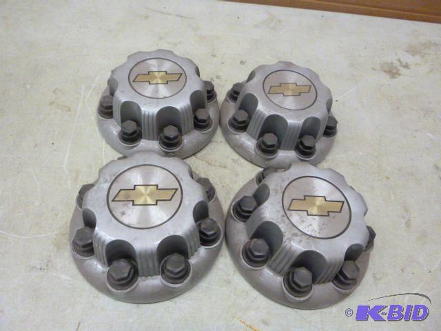 lot 22 image: Four Chevrolet Wheel Covers...