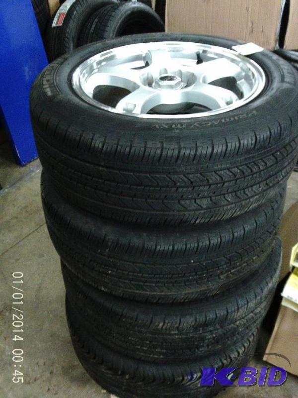lot 28 image: Lot of (4) 21555 R16 90% tread with Rims, M3...