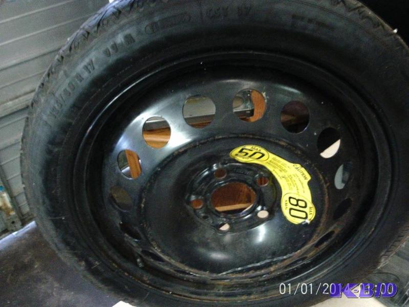 lot 34 image: 5 bolt spare tire with rim, in good condition...