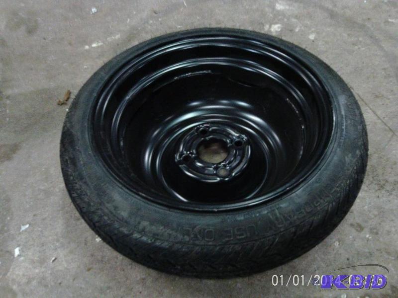 lot 71 image: Temporary spare tire with rim.  ...