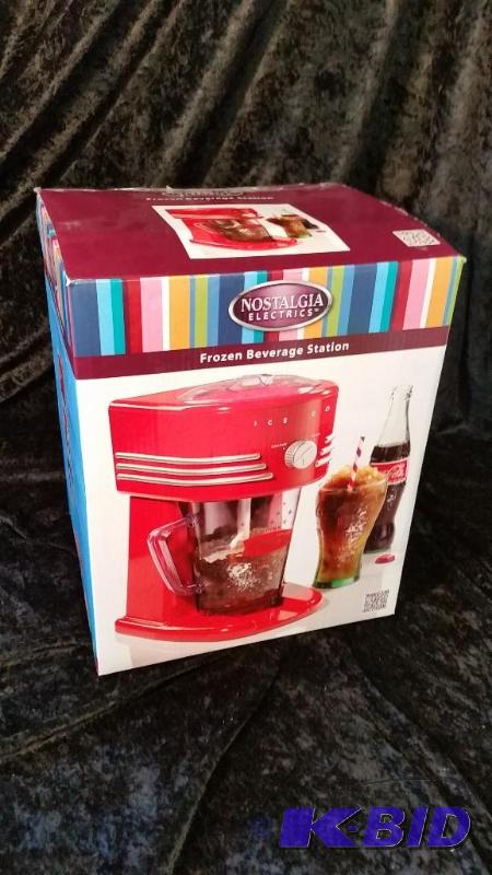 lot 27 image: Nostalgia Electrics Coke Frozen Beverage Maker.  New in Box.  No Manual.