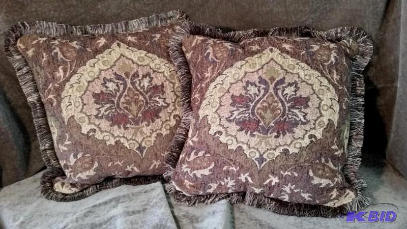 lot 57 image: Lot of 2 Decorative Pillows.  New.  Colors are Golds, and different shades of Brown