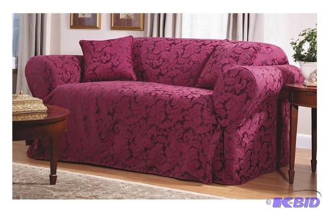 lot 59 image: Sure Fit Scroll Love seat Slipcover.  Burgundy.  New in package.  Was a return.  No rips or tears.